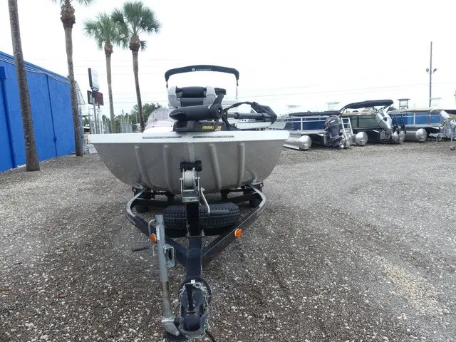 Slide: The Image of A 2018 Alumacraft 175 PROWLER boat on a trailer in a gravel lot. - 3