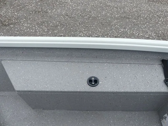 Slide: The Image of The image shows the gray deck of a 2018 Alumacraft 175 PROWLER boat. - 20