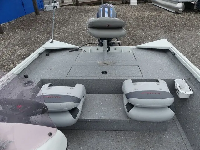 Slide: The Image of The image shows the deck of a 2018 Alumacraft 175 PROWLER boat with gray seating. - 17