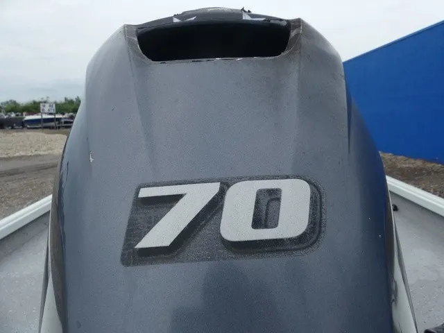 Slide: The Image of Close-up of an outboard motor with the number 70 on it. - 13