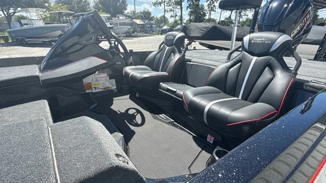 Slide: The Image of The image shows the interior of a 2027 Skeeter ZXE21 boat with two black seats. - 6