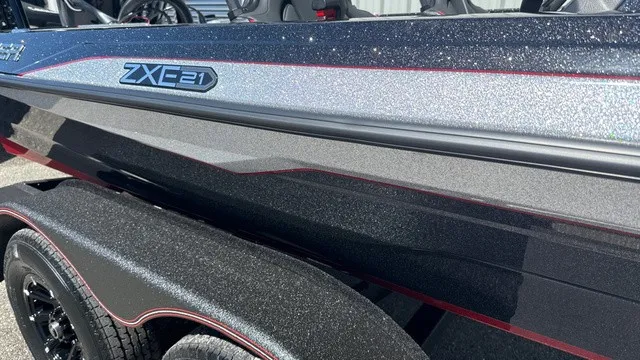 Slide: The Image of 2027 Skeeter ZXE21 with a sleek, sparkling hull and stylish design. - 2