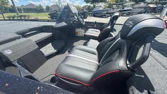 Slide: The Image of The image shows the cockpit of a 2027 Skeeter ZXE21 boat with modern seating and controls. - 5