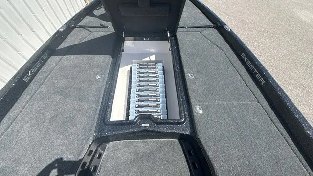 Slide: The Image of The image shows the deck of a 2027 Skeeter ZXE21 boat with a central storage compartment. - 10