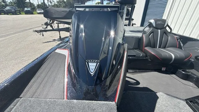 Slide: The Image of The image shows a modern 2027 Skeeter ZXE21 boat with sleek design and comfortable seating. - 12
