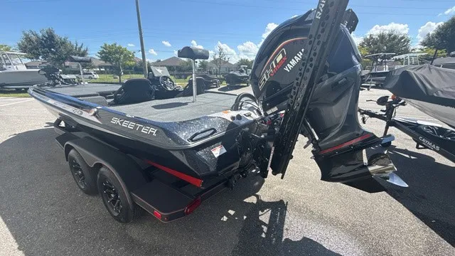 Slide: The Image of A modern 2027 Skeeter ZXE21 on a trailer. The outboard motor is visible. - 4