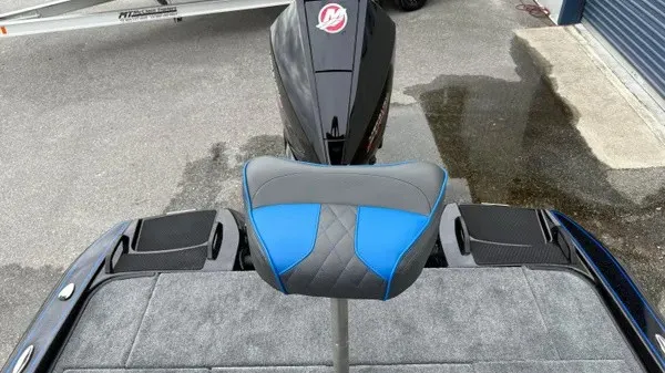 Slide: The Image of The image shows the rear area of a 2027 Phoenix 921 Elite X boat with a blue seat. - 22