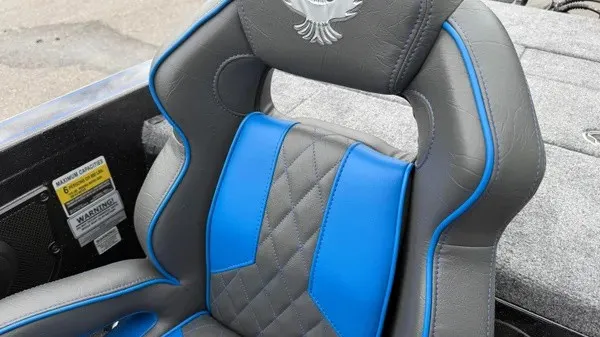 Slide: The Image of The 2027 Phoenix 921 Elite X features a luxurious gray and blue seat with quilted pattern. - 21