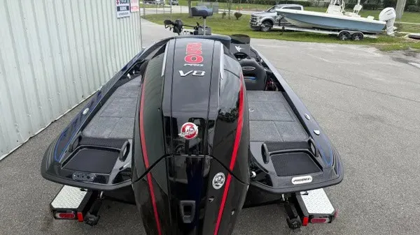 Slide: The Image of The image shows a 2027 Phoenix 921 Elite X boat with a powerful V8 engine. - 6
