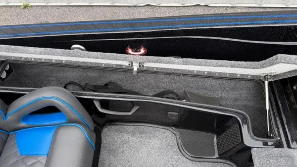 Slide: The Image of Interior view of a 2027 Phoenix 921 Elite X with blue and black seating. - 16