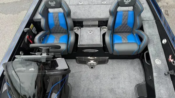 Slide: The Image of The image shows the cockpit of a 2027 Phoenix 921 Elite X boat with two blue seats. - 13