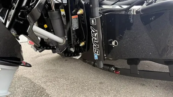 Slide: The Image of Close-up of the engine and controls of a 2027 Phoenix 921 Elite X boat. - 5