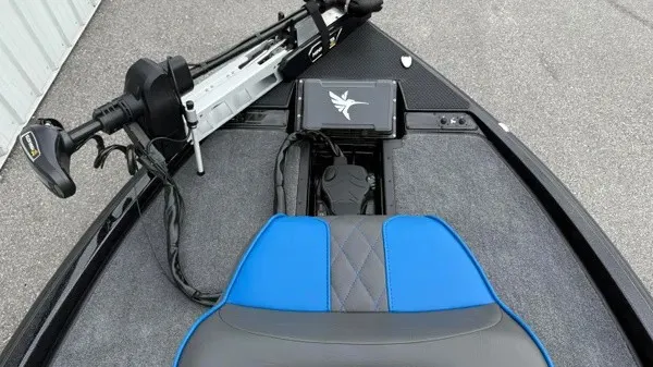 Slide: The Image of The image shows the cockpit of a 2027 Phoenix 921 Elite X boat with a blue seat. - 11