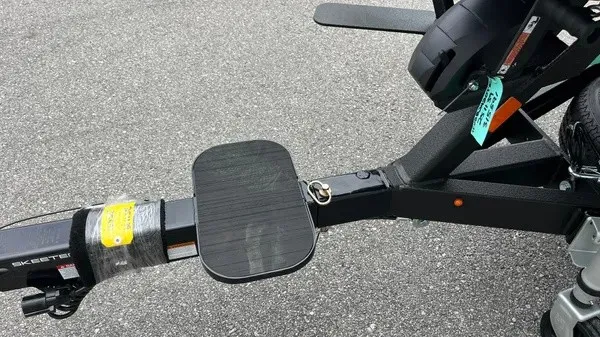 Slide: The Image of Close-up of a boat trailer with a black step and hitch. - 11