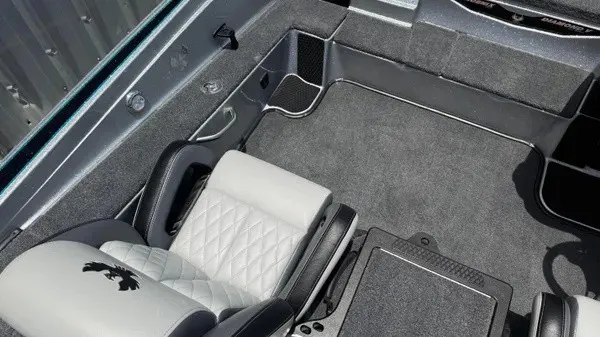 Slide: The Image of Interior of a 2027 Phoenix 721 ZXL with gray carpet and cushioned seats. - 22