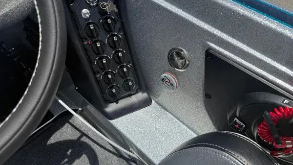 Slide: The Image of The image shows the cockpit of a Phoenix 721 ZXL boat with controls and switches. - 24