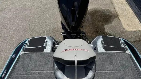Slide: The Image of The image shows the rear of a 2027 Phoenix 721 ZXL boat with an engine. - 21