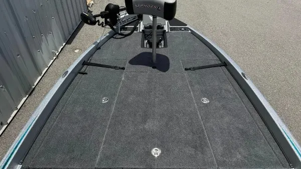 Slide: The Image of The image shows the deck of a 2027 Phoenix 721 ZXL boat with gray carpeting. - 17