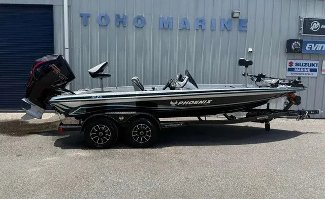 The Image of A 2027 Phoenix 721 ZXL boat on a trailer in front of a building. - 1