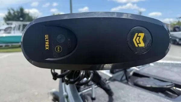 Slide: The Image of Close-up of a boat motor with "Ultrex" logo and a yellow symbol. - 13
