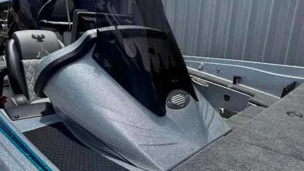 Slide: The Image of The image shows the cockpit of a Phoenix 721 ZXL boat with a shimmering gray finish. - 15