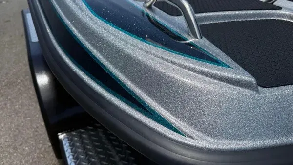 Slide: The Image of Close-up of the bow of a 2027 Phoenix 721 ZXL with a shiny metallic finish. - 7