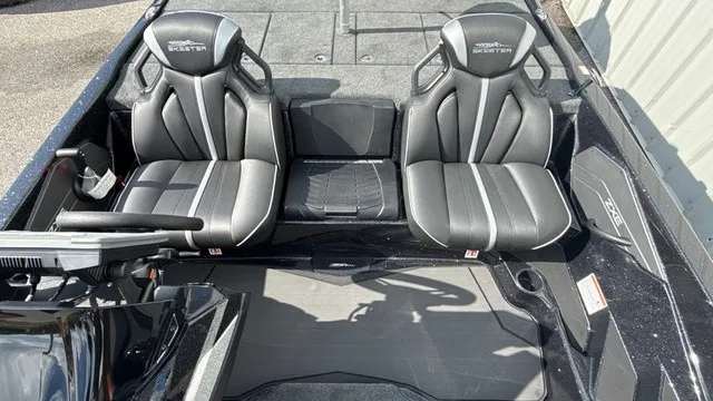 Slide: The Image of The image shows the interior of a 2027 Skeeter ZXE20 boat with two black seats. - 17
