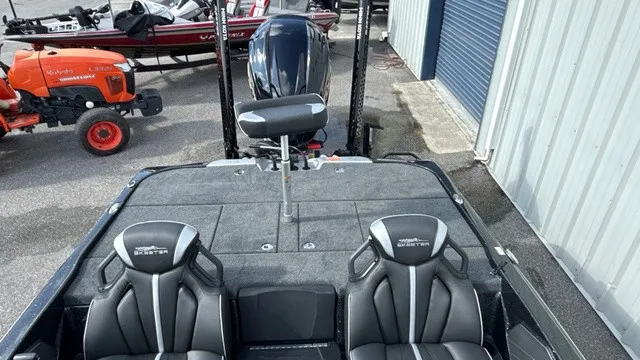Slide: The Image of The image shows the rear of a 2027 Skeeter ZXE20 boat with two black seats and an outboard motor. - 9
