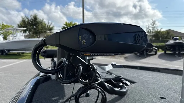 Slide: The Image of Close-up of a boat control system on a 2027 Skeeter ZXE20, with cables and a cloudy sky in the background. - 7