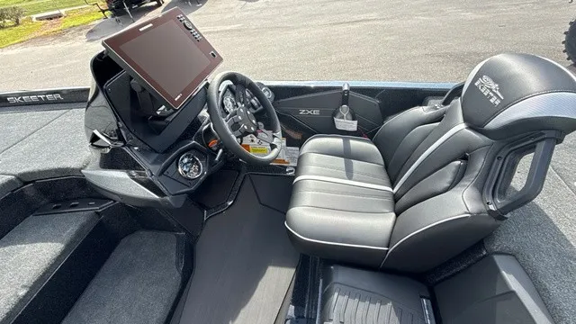 Slide: The Image of The image shows the cockpit of a 2027 Skeeter ZXE20 boat with a modern helm and comfortable seating. - 10