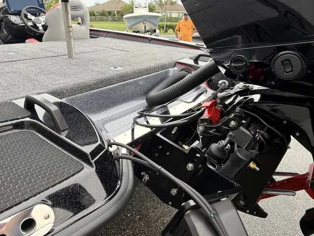 Slide: The Image of The image shows the rear of a 2027 Phoenix 921 Elite X II boat with engine and cables. - 7