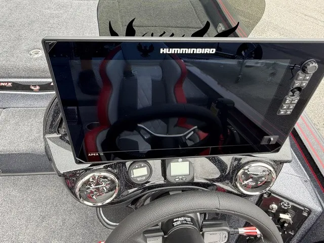 Slide: The Image of The image shows the cockpit of a Phoenix 921 Elite X II boat with a large Humminbird screen. - 16