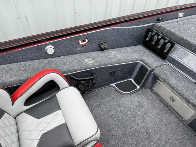 Slide: The Image of Interior of a 2027 Phoenix 921 Elite X II with gray carpet and red accents. - 17