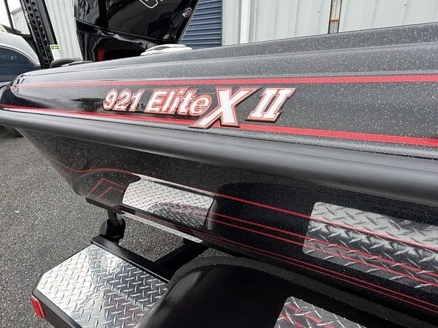 Slide: The Image of Close-up of the Phoenix 921 Elite X II with a glossy black hull and red accents. - 4