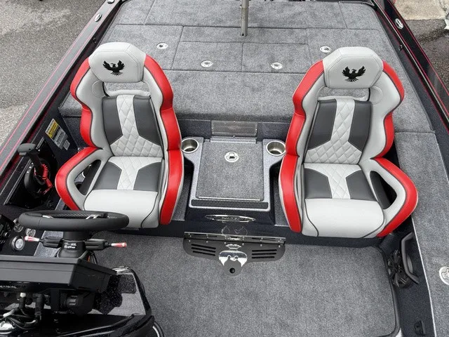 Slide: The Image of The image shows the interior of a 2027 Phoenix 921 Elite X II with two padded seats. - 9