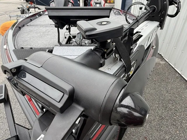 Slide: The Image of Close-up of a boat motor and controls on a 2027 Phoenix 921 Elite X II. - 13