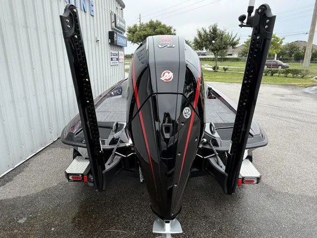Slide: The Image of The image shows the rear of a 2027 Phoenix 921 Elite X II boat with a powerful outboard motor. - 5