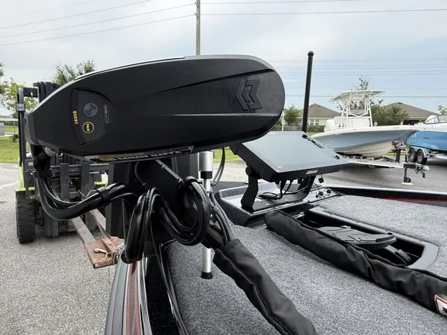 Slide: The Image of Close-up of a modern boat motor and control system on a 2027 Phoenix 921 Elite X II. - 12