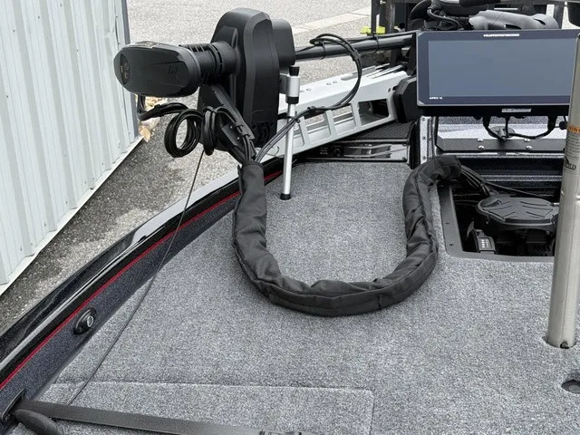 Slide: The Image of The image shows the deck of a Phoenix 921 Elite X II boat with modern electronics. - 25