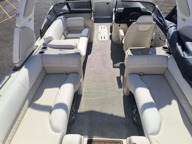 Slide: The Image of Interior view of a luxury pontoon boat with white leather seating and a modern helm. - 7