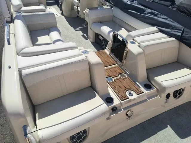 Slide: The Image of Luxurious seating area on a 2027 Avalon Excalibur LTD Twin SS 25 FT with beige upholstery. - 19