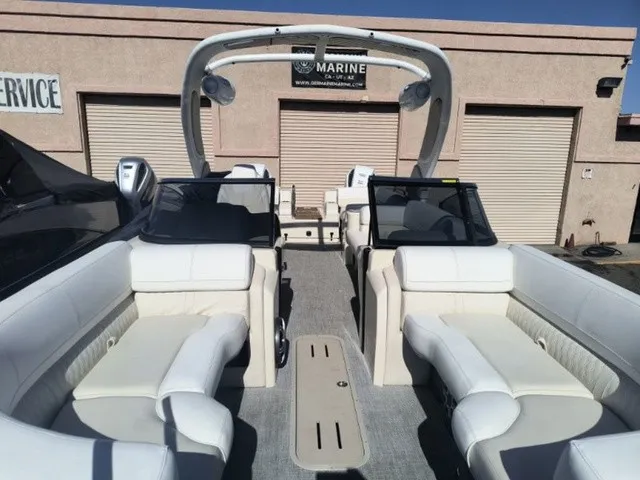 Slide: The Image of The image shows the interior of a 2027 Avalon Excalibur LTD Twin SS 25 FT with luxurious white seating. - 16