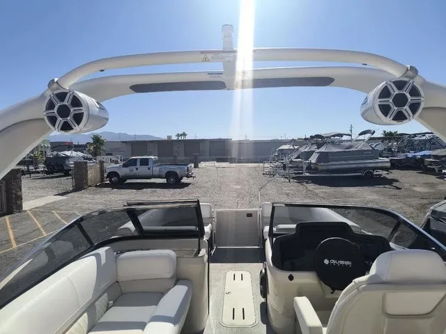 Slide: The Image of The image shows the cockpit of a 2027 Avalon Excalibur LTD Twin SS 25 FT with luxurious seating and a modern helm. - 15