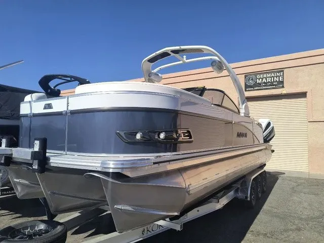 Slide: The Image of A luxurious Avalon Excalibur LTD Twin SS 25 FT boat from 2027 on a trailer. - 5