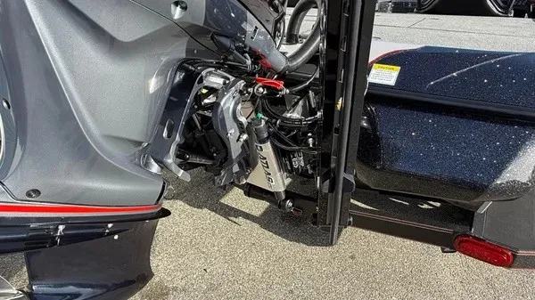 Slide: The Image of Close-up of a boat engine with visible cables and components. - 4