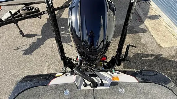 Slide: The Image of Skeeter ZXE20 2026: View of the engine and rear of the boat on a trailer. - 24
