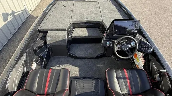 Slide: The Image of The image shows the cockpit of a 2026 Skeeter ZXE20 boat with two black seats and a modern helm. - 13