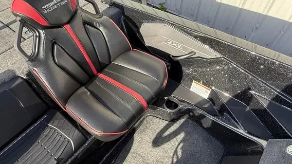 Slide: The Image of The 2026 Skeeter ZXE20 features a stylish seat with black and red accents. - 20