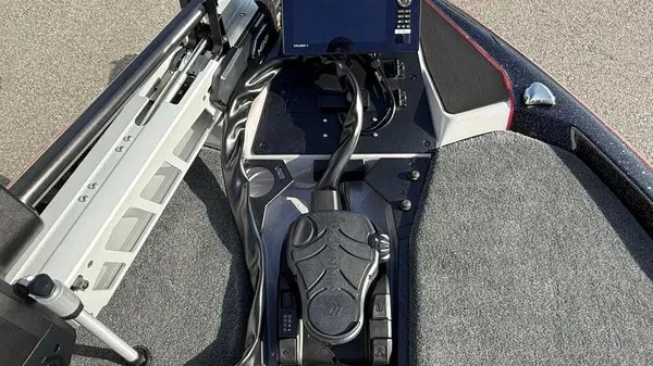 Slide: The Image of The image shows the cockpit of a Skeeter ZXE20 boat with a modern control system. - 16
