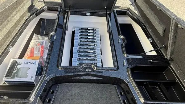 Slide: The Image of 2026 Skeeter ZXE20 with open storage hatch and battery compartment. - 15